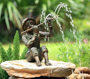 bronze fountain small boy playing flute